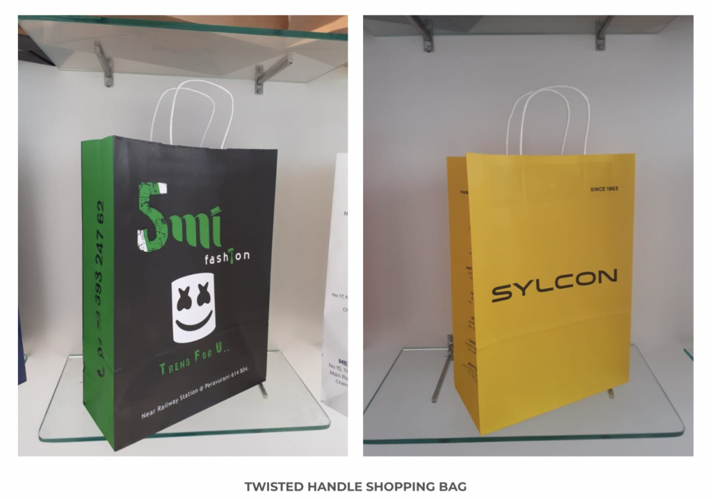 The image shows twisted paper shopping bags by RedibagUSA.